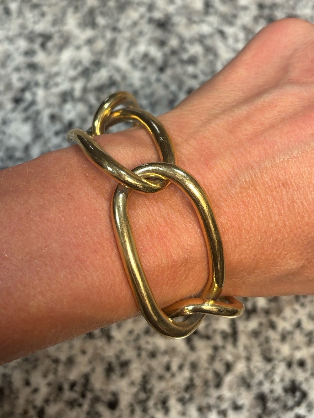 Gold large “paper clip” bracelet